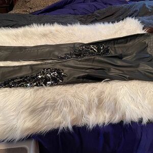 Black pants with sequin enhancement.